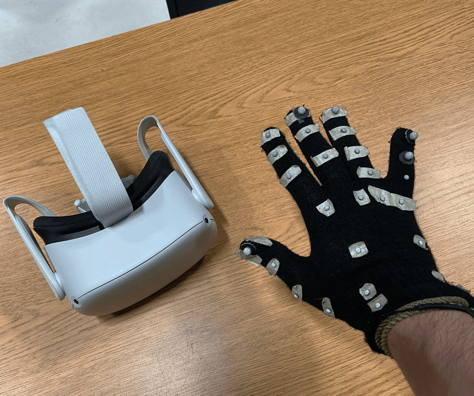 Headset and the custom Vicon tracking glove designed by my co-author.